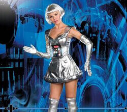 A blond fembot stands in front of a futuristic background.