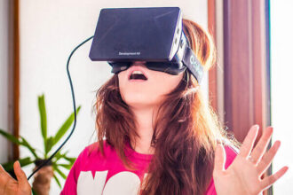 A woman wears the virtual reality headset Oculus Rift.