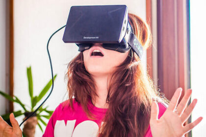 A woman wears the virtual reality headset Oculus Rift.