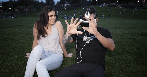 A man watches VR porn next to a woman.