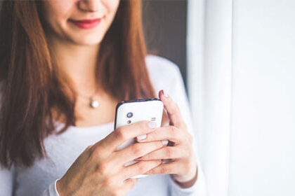 Girl using a smartphone.