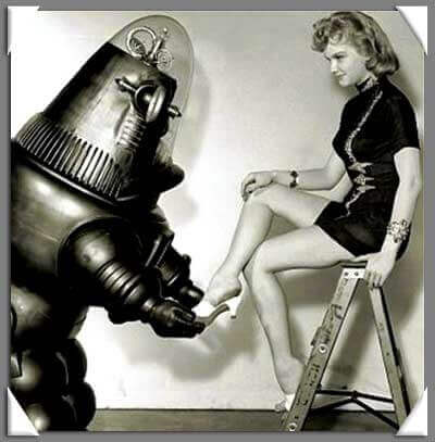 A robot helps a woman put on her shoe.