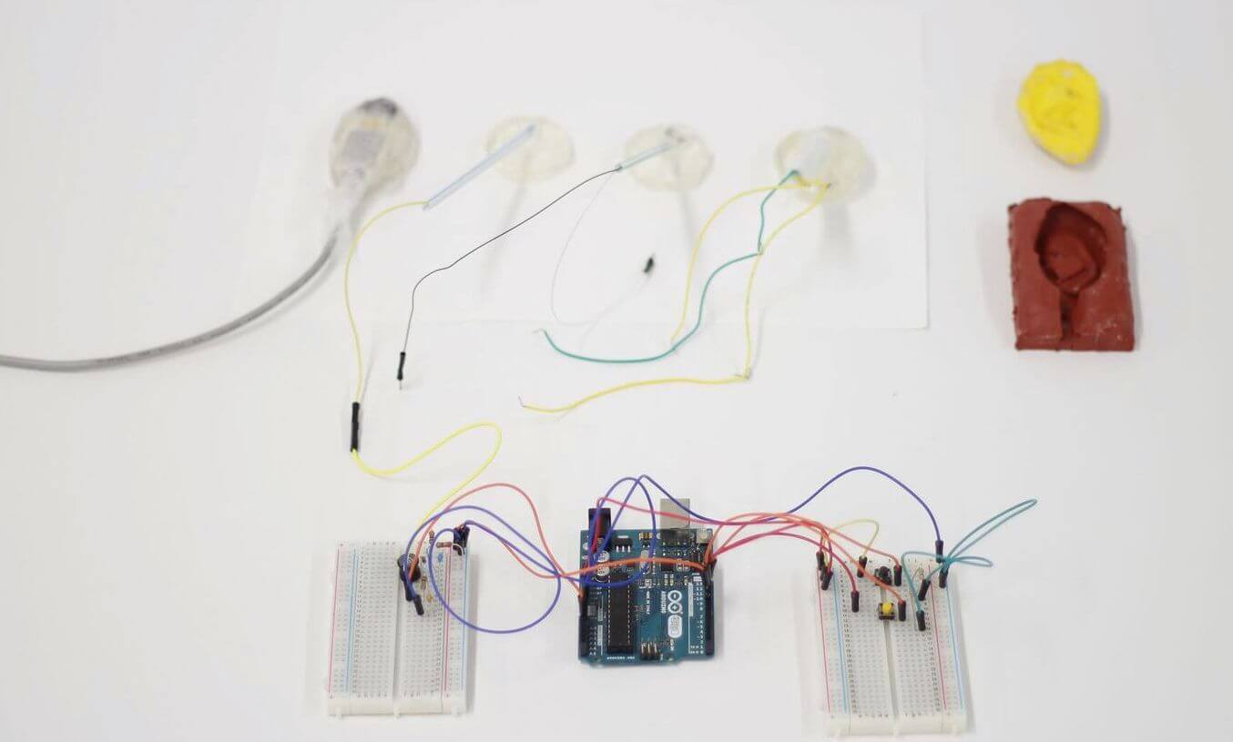 The components of the Teletongue long-distance kissing device are displayed.