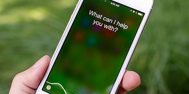 Voice assistant Siri asks if she can help.