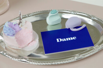 Eva and Fin, sex toys from Dame Products, on a platter.