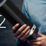 A man holds up the Kiiroo Onyx2 male sex sleeve.