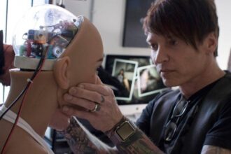 Abyss Creations CEO Matt McMullen works on his robotic creation Harmony.