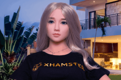 Sex doll xHamsterina appears with blonde hair, Asian features, and a black T-shirt.