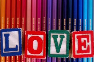 Screenshot showing colorful pencils with LOVE letters engraved on dice
