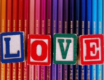 Screenshot showing colorful pencils with LOVE letters engraved on dice