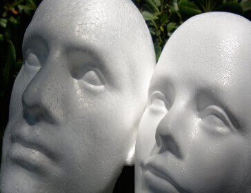 Screenshot of Styrofoam Faces of Male and Female In the Garden