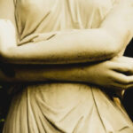Image of Three Statues Holding their Hands