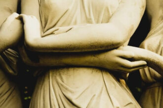 Image of Three Statues Holding their Hands