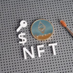 NFT letters and ethereum-style coin with paintbrush