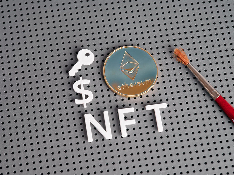 NFT letters and ethereum-style coin with paintbrush