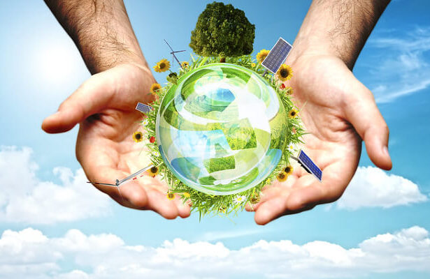 hands holding green orb with green energy