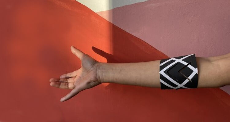 Screenshot of right hand with a band wrapped on it