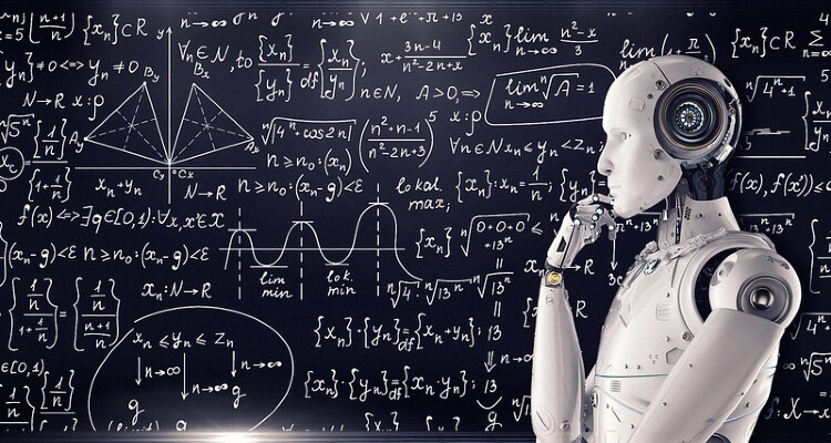 Robot standing in front of a board covered with equations (attribution: Mike MacKenzie)