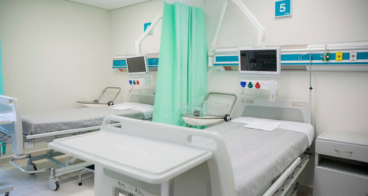 room in a hospital with two empty beds