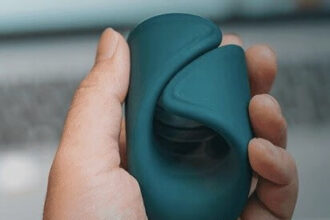 The Lovense Gush is a flexible and hands-free glans massager with a curved, wrap-like design that surrounds the penis and stimulates the tip.