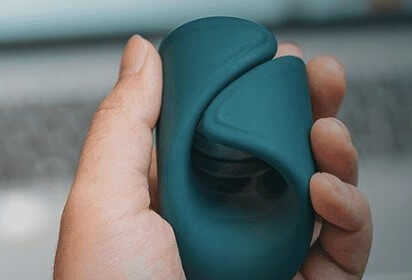 The Lovense Gush is a flexible and hands-free glans massager with a curved, wrap-like design that surrounds the penis and stimulates the tip.