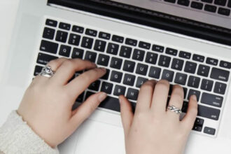 hands at computer