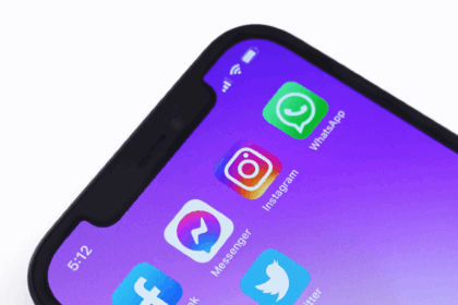 Social media apps on purple smarphone background