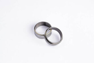 Two plain silver wedding bans sitting against a white background.