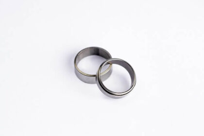 Two plain silver wedding bans sitting against a white background.