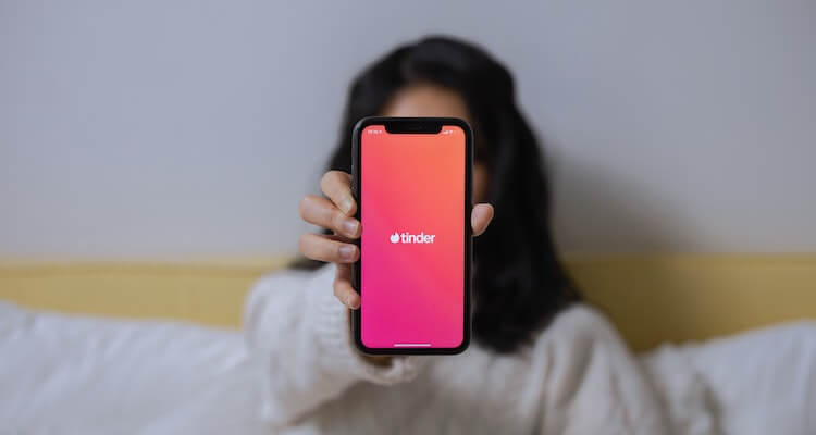 A Woman Showing Her Smartphone.